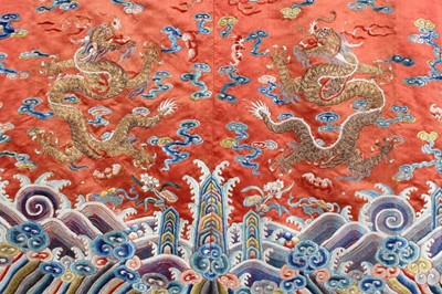 Lot 259 - An embroidered orange satin dragon robe,...