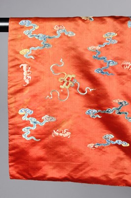 Lot 259 - An embroidered orange satin dragon robe,...