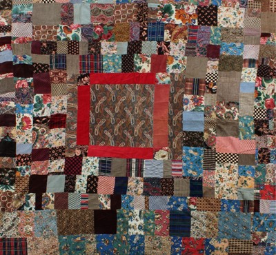 Lot 389 - A velvet patchwork coverlet, incorporating men'...