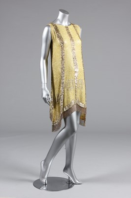 Lot 240 - A beaded primrose-yellow muslin flapper dress,...