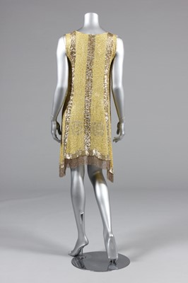 Lot 240 - A beaded primrose-yellow muslin flapper dress,...