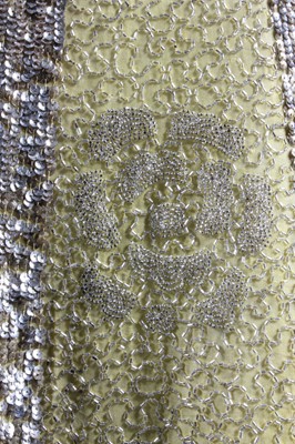 Lot 240 - A beaded primrose-yellow muslin flapper dress,...