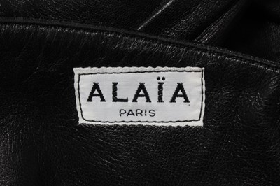Lot 222 - An Azzedine Alaia soft black leather skirt and...