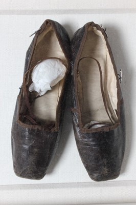 Lot 129 - A pair of brown leather infant shoes and...