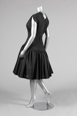 Lot 135 - A Carven couture black silk dinner dress, late...