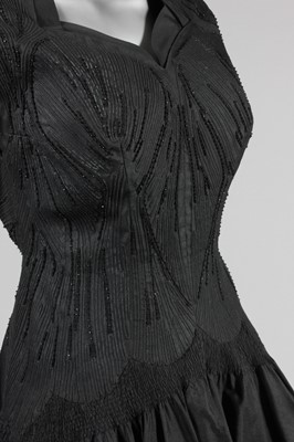 Lot 135 - A Carven couture black silk dinner dress, late...