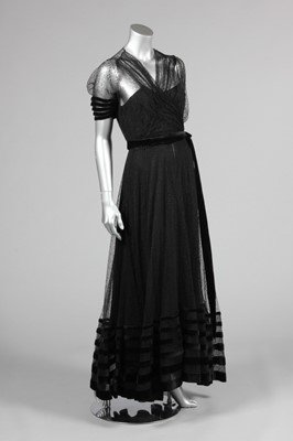 Lot 139 - A couture black lace and velvet edged evening...