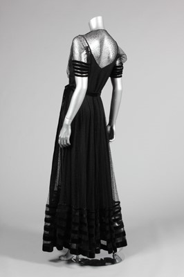 Lot 139 - A couture black lace and velvet edged evening...