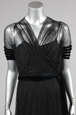 Lot 139 - A couture black lace and velvet edged evening...