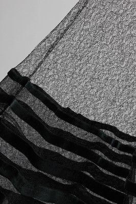 Lot 139 - A couture black lace and velvet edged evening...