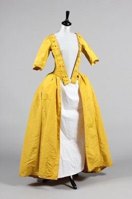 Lot 141 - A Chinese-yellow silk open-robe, circa 1770,...