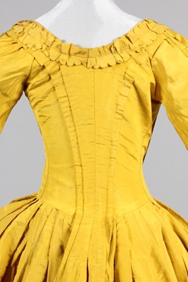 Lot 141 - A Chinese-yellow silk open-robe, circa 1770,...