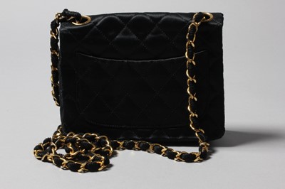 Lot 155 - A Chanel quilted satin shoulder bag, 1986-7,...