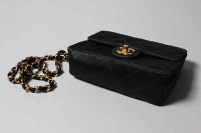 Lot 155 - A Chanel quilted satin shoulder bag, 1986-7,...