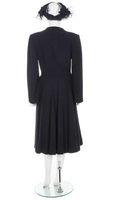 Lot 146 - A Norman Hartnell couture navy wool coat, 1948,...