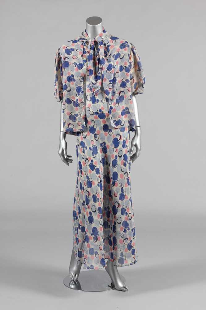 Lot 170 - A printed chiffon garden party gown, circa...