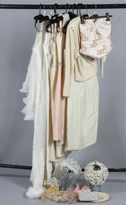 Lot 177 - Eleven bridal/ivory dresses, 1960s-80s,...