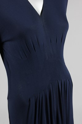 Lot 163 - A Carven couture navy silk jersey evening gown,...