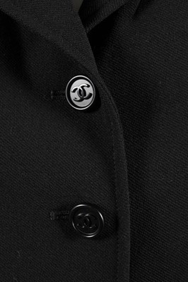 Lot 192 - A Chanel boutique black jacket, 1990s,...