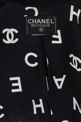 Lot 192 - A Chanel boutique black jacket, 1990s,...