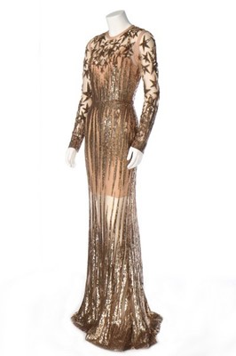 Lot 111 - A gold sequinned tulle 'illusion' evening gown...