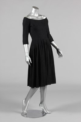 Lot 200 - A Jacques Heim black boucle wool dinner dress,...