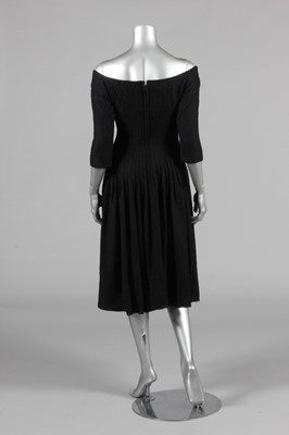 Lot 200 - A Jacques Heim black boucle wool dinner dress,...
