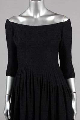 Lot 200 - A Jacques Heim black boucle wool dinner dress,...