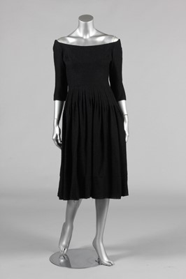 Lot 200 - A Jacques Heim black boucle wool dinner dress,...