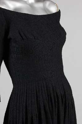 Lot 200 - A Jacques Heim black boucle wool dinner dress,...