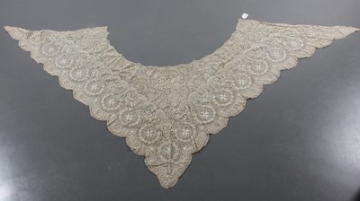 Lot 405 - An ivory silk Maltese bobbin lace shawl, late...