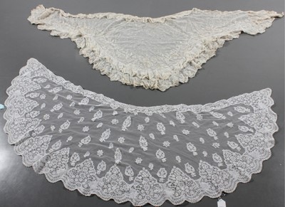 Lot 405 - An ivory silk Maltese bobbin lace shawl, late...