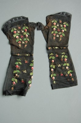 Lot 404 - A pair of embroidered black silk mitts, mid...