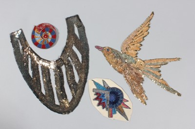 Lot 211 - A large group of embroidered motifs, hat bands,...