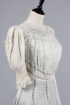 Lot 215 - A Valenciennes lace inset summer gown, circa...