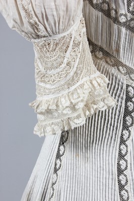 Lot 215 - A Valenciennes lace inset summer gown, circa...