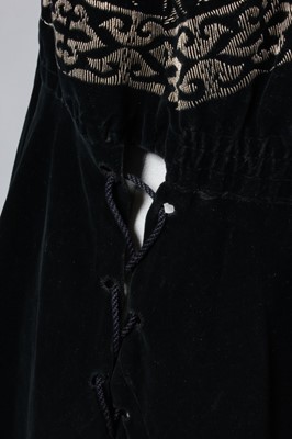 Lot 216 - An embroidered midnight-blue velvet tunic,...