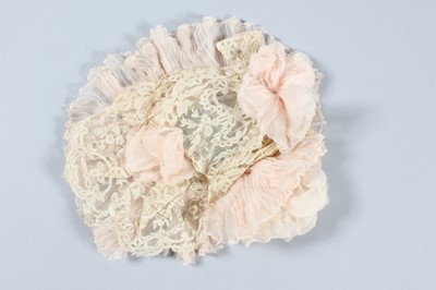 Lot 219 - A Madame Doucet Brussels lace and pink...