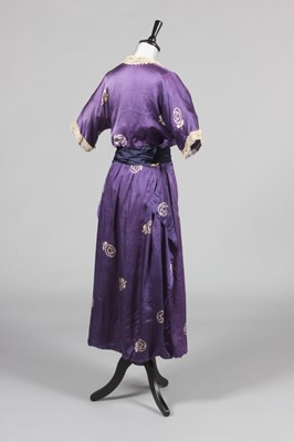 Lot 221 - A printed satin dress, the fabric in imitation...