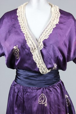 Lot 221 - A printed satin dress, the fabric in imitation...