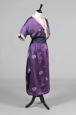 Lot 221 - A printed satin dress, the fabric in imitation...