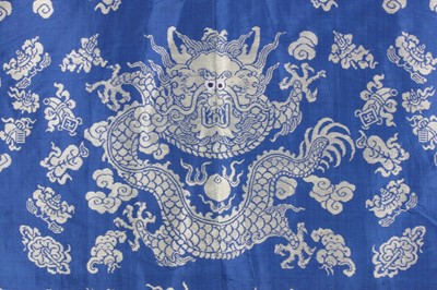 Lot 265 - A brocaded silk dragon robe, jifu, circa 1900,...