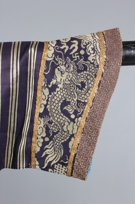 Lot 265 - A brocaded silk dragon robe, jifu, circa 1900,...