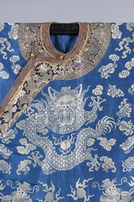 Lot 265 - A brocaded silk dragon robe, jifu, circa 1900,...