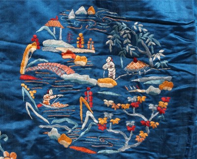 Lot 270 - An embroidered blue satin informal lady's robe,...