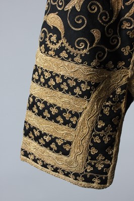 Lot 288 - A lavishly embroidered black wool jacket,...