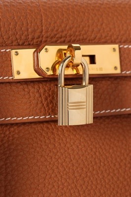 Lot 52 - An Hermès gold togo leather Kelly 28 bag,...