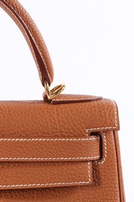 Lot 52 - An Hermès gold togo leather Kelly 28 bag,...