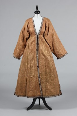 Lot 328 - A woman's chapan robe of gold and pink Persian...