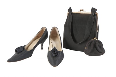 Lot 153 - A pair of Christian Dior black silk shoes,...